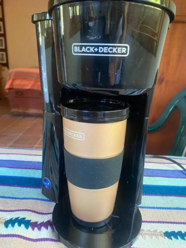 a black blender sitting on top of a table at Peaceful Hideaway in Santa Cruz La Laguna