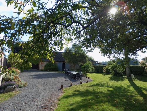a group of benches sitting on the side of a road at Gîte du Coudray in Neuillé-Pont-Pierre