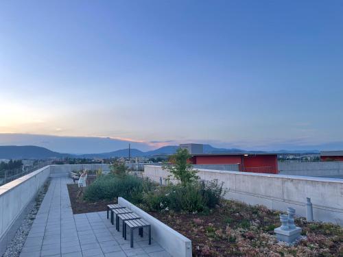 a group of benches sitting on top of a building at 100 qm Penthouse, Self-Check-In, 2 Parkplätze in Graz