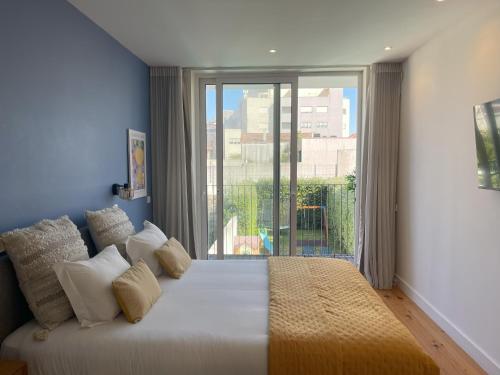 Una cama o camas en una habitación de BlueCap by MyTrip Porto