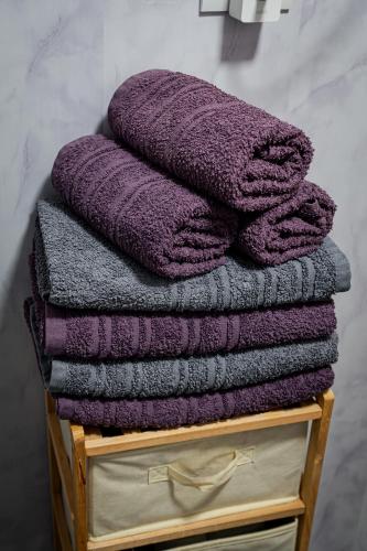 a pile of towels sitting on a wooden crate at Cabana VP in Alunişu