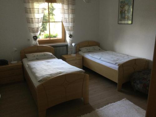 Postel nebo postele na pokoji v ubytování FeWo Beistoi