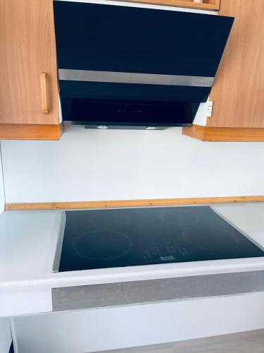 a drawer in a kitchen cabinet with the door open at VS-Homestay in Sakskøbing