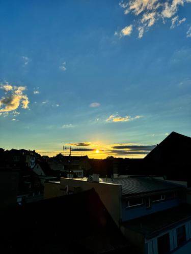 a view of the sunset from a city at Exclusive Rooftop Duplex Penthouse - 200sqm - 280 Panoramic Views - Downtown in Basel