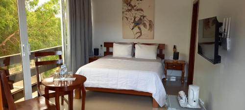 Ένα ή περισσότερα κρεβάτια σε δωμάτιο στο Viajante