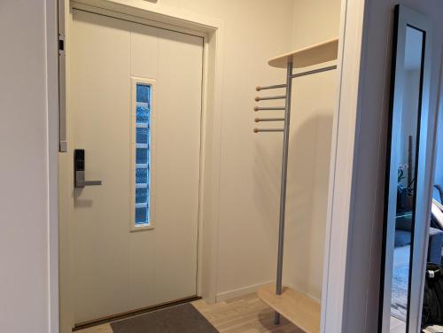 a door in a room with a window at Green appartement in Sandnes