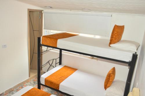 Postel nebo postele na pokoji v ubytování Hotel Flamante Bulevar