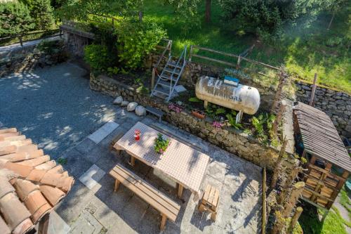 an overhead view of a garden with a train on the tracks at Chalet Corona in Giustino