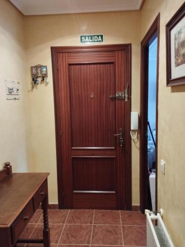 a door in a room with a sign on it at La Casa de Conchi in Comillas