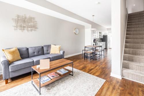 a living room with a couch and a table at Luxury Downtown Townhome Unit 15 in Cleveland