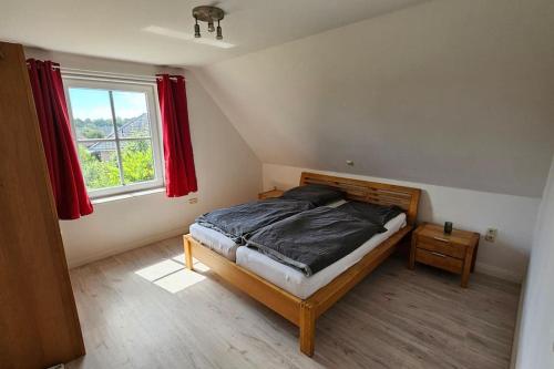 Ένα ή περισσότερα κρεβάτια σε δωμάτιο στο Haus zwischen den Stränden