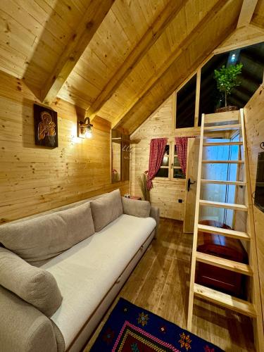 a living room with a couch and a ladder at Etno kuca Lana in Mojkovac