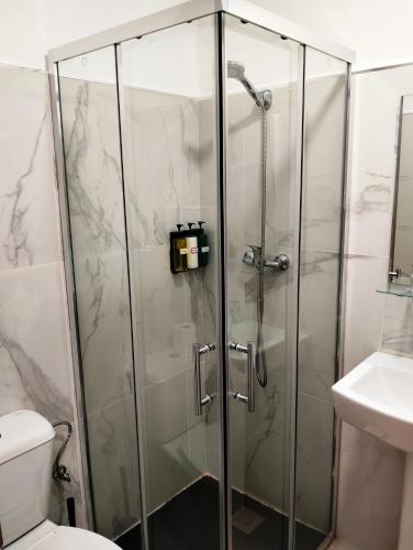 a shower with a glass door in a bathroom at El Rinconcito de Ensueño in Gran Tarajal