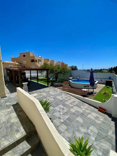 a view of a patio with a swimming pool at Vivenda Sossego do Mar in Ferragudo