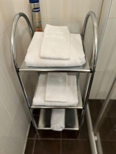 a towel rack with towels on it in a bathroom at Charming flat next to Old Town and Harbor in Tallinn