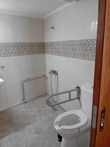 a bathroom with a toilet and a shower at AZOGIRE Resort in Azoyirés