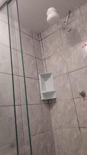 a bathroom with a shower with a toilet in it at Casa simples Natal Luz e FIG in Garanhuns
