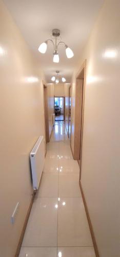 a hallway of an office building with a long corridor at London Luxury 3 bedroom flat, 2 bathrooms, Living Room, free parking, 4 mins to station, garden in Ilford