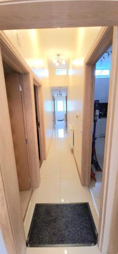 a view of a hallway in a house at London Luxury 3 bedroom flat, 2 bathrooms, Living Room, free parking, 4 mins to station, garden in Ilford