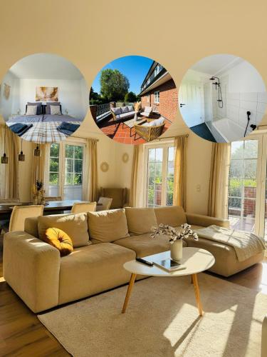 沙博伊茨Familientraum an der wunderschönen Ostsee in Scharbeutz - Strandnah, kostenloses Parken & Terasse!W2的客厅里有一张沙发和一张桌子。