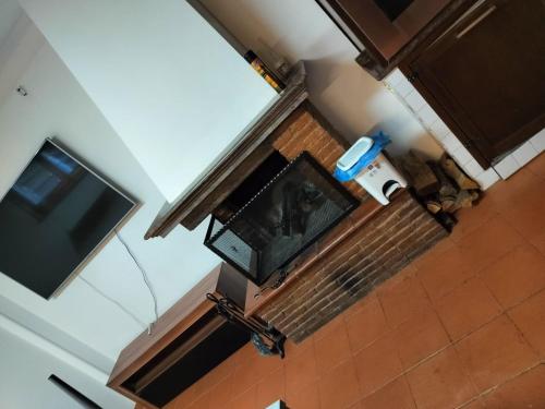 an overhead view of a living room with a fireplace and a television at DolceVita Eur2 Luxury Apartament in Rome