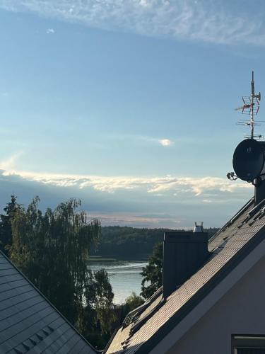 a view of a river from the roof of a house at Apartament Słoneczny widok boczny na jezioro in Charzykowy