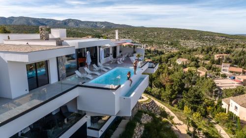 an aerial view of a house with a swimming pool at Suite 28 in Treilles