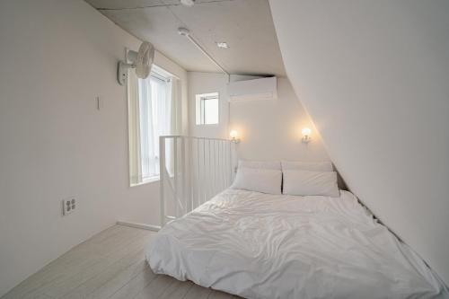 The Phase Boutique Hotel 동대문にあるベッド