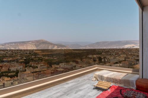 a room with a view of a city at tayyurt host in Agadir