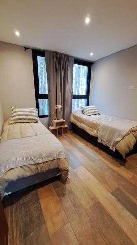 Postel nebo postele na pokoji v ubytování Casa MARITE II
