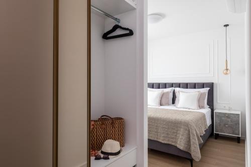 a bedroom with a bed and a mirror at Villa AG in Podstrana