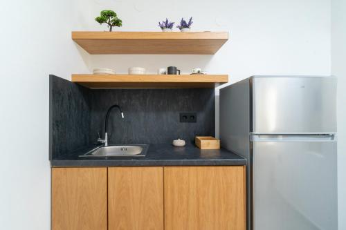 Nhà bếp/bếp nhỏ tại Parilion Suites