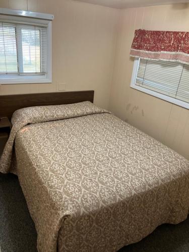 Un ou plusieurs lits dans un hébergement de l'établissement Idle A While Cabins