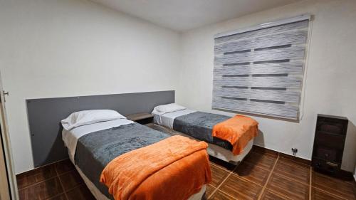 Ένα ή περισσότερα κρεβάτια σε δωμάτιο στο Casa Céntrica