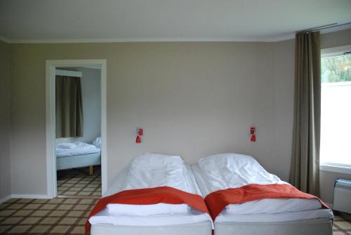 Ένα ή περισσότερα κρεβάτια σε δωμάτιο στο Fleischer's Motel