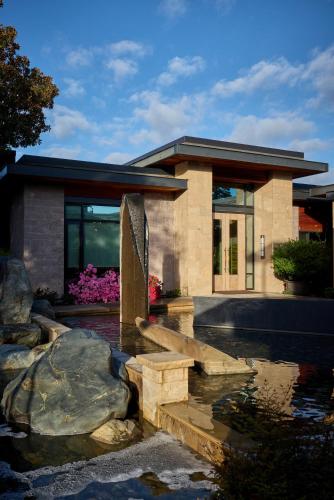 a building with a water fountain in front of it at Bardessono Hotel and Spa in Yountville