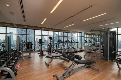 a gym with treadmills and elliptical machines at Staybridge Suites Bangkok Thonglor by IHG in Bangkok