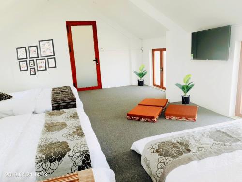 Postel nebo postele na pokoji v ubytování RiverView Homestay 2