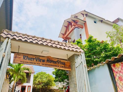 a sign on a building with a keep view home sign at RiverView Homestay 2 in Xóm Ðé