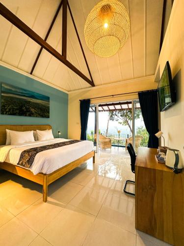 a bedroom with a large bed in a room at Villa Borobudur Resort in Borobudur