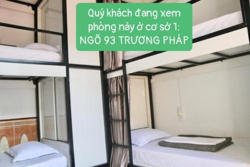 a sign in a room with bunk beds at RiverView Homestay 2 in Xóm Ðé