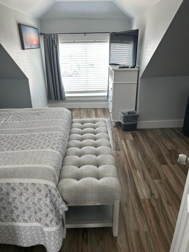 a bedroom with a bed and a window at Sea Shell in Old Orchard Beach