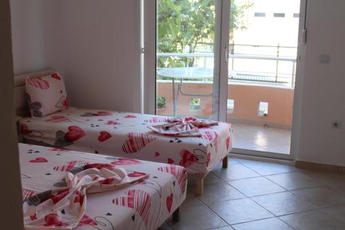 Postel nebo postele na pokoji v ubytování Apartments Luana