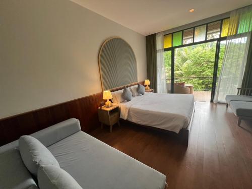 Postel nebo postele na pokoji v ubytování K.B. Resort