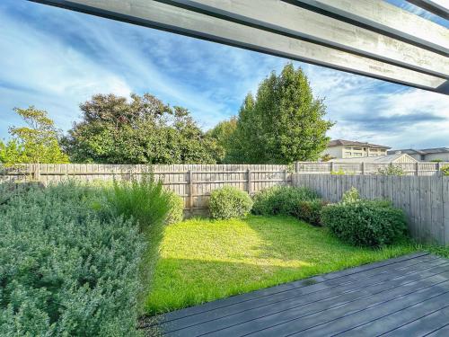 a backyard with a fence and a wooden deck at 89B - Your Dream Stay Business or Travel Mornings with coffee in Bentleigh in Heatherton