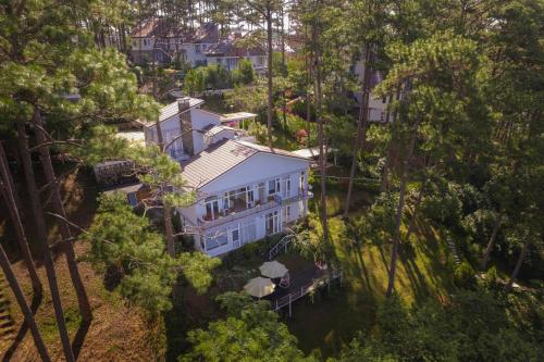 an overhead view of a large white house with trees at The Dream Villa Best Lake View in Xuan An