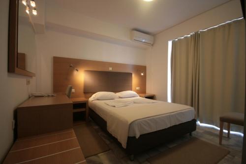 Postel nebo postele na pokoji v ubytování Liberty Hotel
