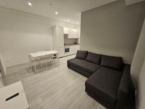 a living room with a couch and a table at MiPA in Milazzo