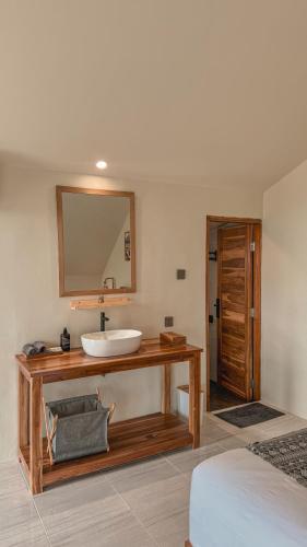 a bathroom with a sink and a mirror at Aloka Penida in Klungkung