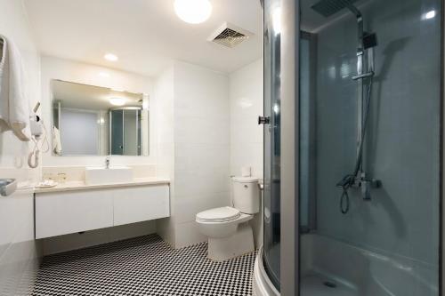 a bathroom with a toilet and a sink and a shower at Lam Kinh Hotel in Ho Chi Minh City